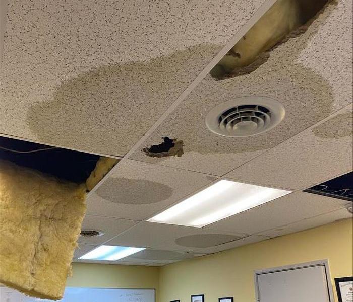 Wet ceiling tiles and insulation from a pipe bursting
